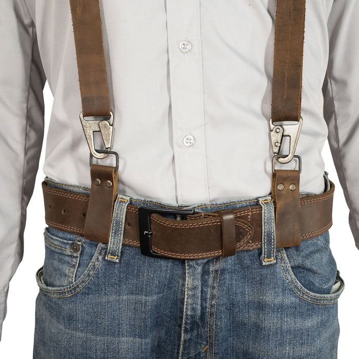A model wearing the Set of 2 Riveted Suspender Loop Attachments by Hide & Groom, showcasing how these full grain leather suspender loops complement a stylish outfit. Perfect for men looking for heavy-duty wedding accessories, these artisan-crafted pieces are handmade in La Antigua Guatemala & Oaxaca Mexico.