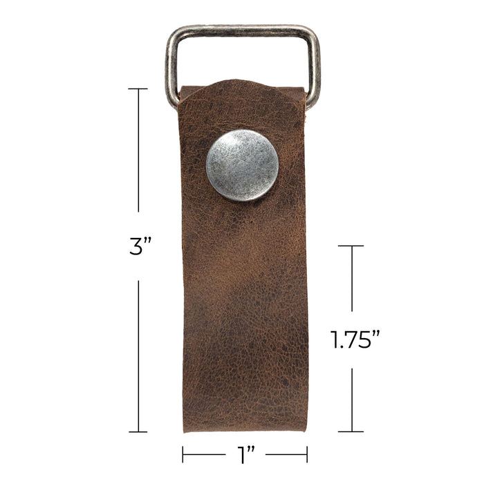 A size comparison of the Set of 2 Suspender Loop Attachments with Snap Closure by Hide & Groom against a measuring scale, emphasizing their compact and functional design. Set of 2 Suspender Loops Attachment for Men with Snap Closure, Heavy Duty, Wedding Accessories, Full Grain Leather, StockyardX, Small Batch Production, Hand Cut, Hand Sewn, Fire Branded, Artisan, Handmade in La Antigua Guatemala & Oaxaca Mexico.