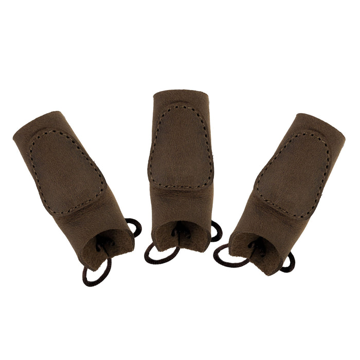 Three pieces of the Set of 3 Finger Protectors for Archery by Valhalla Gear on a white background. Constructed from full grain leather, these handy archer accessories serve as hand guards for shooting targeting and cosplay. They are expertly hand cut, hand sewn, and fire branded, showcasing the artisan quality of small batch production from La Antigua Guatemala.
