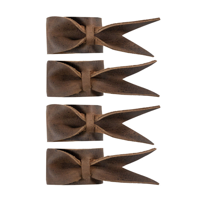 Chic Set of 4 Napkin Rings for Weddings by Hide & Groom, displaying a close-up of leather napkin rings with a unique bow design. These napkin holders are perfect for wedding receptions and dinner parties, utilizing full grain leather through hand cut and hand sewn methods, crafted in La Antigua Guatemala & Oaxaca Mexico.