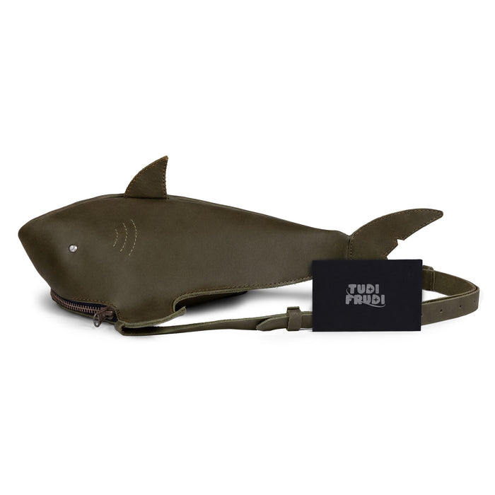 Shark-Shaped Shoulder Bag by Tudi Frudi displayed with its branding tag. This unique bag made from Full Grain Leather serves as a Crossbody or Messenger Bag and represents artisan craftsmanship, handmade in La Antigua Guatemala.