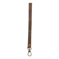 A simple thin lanyard made of Full Grain Leather, showcasing its durable design and artisan craftsmanship by Hide & Drink, perfect for organizing items. This Simple Thin Lanyard features tags such as Small Batch Production, Hand Cut, Hand Sewn, Fire Branded, Artisan, Handmade in La Antigua Guatemala & Oaxaca Mexico.