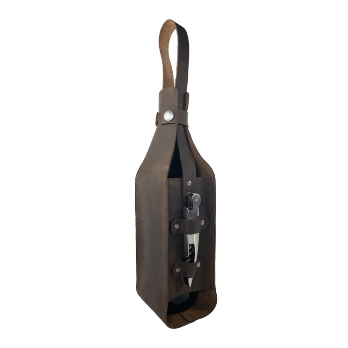 Stylish side view of Hide & Drink's Single Bottle Wine Carrier made from Full Grain Leather. This Handmade leather piece, part of their Small Batch Production, highlights the artisanal skills of local craftsmen in La Antigua Guatemala & Oaxaca Mexico, combining elegance with durability in a Single Bottle Wine Carrier.