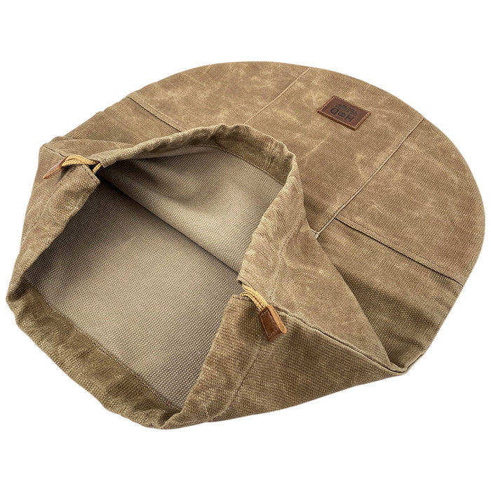 Inside view of the Skillet Bag Cover by Hide & Drink, highlighting the protective lining. Ideal for a rustic bag for a 12 Inch Frying Pan, this durable waxed canvas product illustrates small-batch artisan quality, hand cut and hand sewn in La Antigua Guatemala and Oaxaca Mexico.