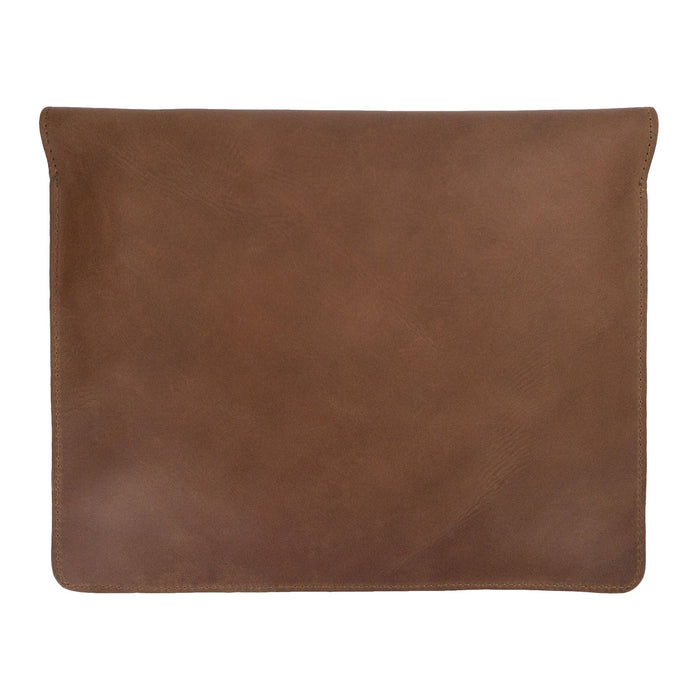 Side view of Hide & Drink's Slim Portfolio in brown, showcasing its elegant design as a handmade Flat Messenger Case. This Full Grain Leather Narrow Document Holder is an essential office accessory, made by artisans in La Antigua Guatemala & Oaxaca Mexico.