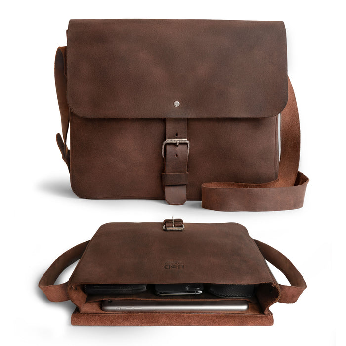 Hide & Drink’s Small Messenger Bag with tags, revealing its craftsmanship and origin. Made from high-quality Full Grain Leather, this durable crossbody bag represents a perfect travel accessory, artfully hand cut and sewn by artisans in La Antigua Guatemala & Oaxaca Mexico.