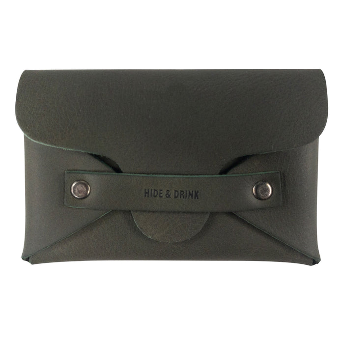 Discover the Snapless Business Card Holder by Hide & Drink, a vintage wallet perfect for men and women. This sturdy pouch made from Full Grain Leather serves as a practical money organizer and reflects the brand's commitment to artisan work from La Antigua Guatemala & Oaxaca Mexico.