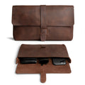 Hide & Drink Snapless Clutch Bag showcasing a rustic full grain leather design, perfect for organizing accessories like phones and sunglasses. This elegant clutch bag is part of small batch production that is hand cut and hand sewn by artisans in La Antigua Guatemala. Ideal as a case for your essentials and a stylish accessory.