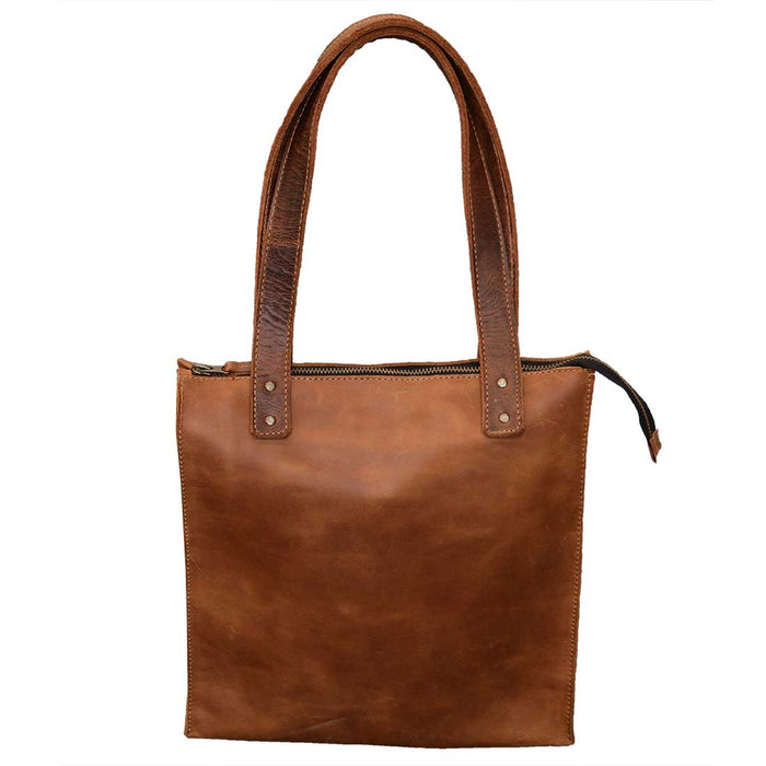 The Square Shoulder Bag by Hide & Drink is a beautifully handcrafted handbag made from full grain leather, showcasing a unique vintage look. This purse is perfect for everyday use and offers a touch of artisan charm, featuring small batch production techniques, fire branded details, and is handmade in La Antigua Guatemala & Oaxaca Mexico.