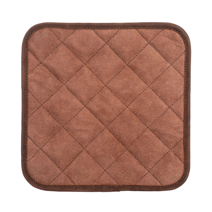A top-down view of the Cast Leather Co. Squared Hot Pot Pad, emphasizing its quality and detail. This Squared Oven Mitt Heat Resistant, Hot Pot Pad (Potholder) is essential for bakery supplies, fashioned from full grain leather and sheepskin. Showcasing stockyardX's small batch production, it is hand cut, hand sewn, and fire branded in La Antigua Guatemala & Oaxaca Mexico.