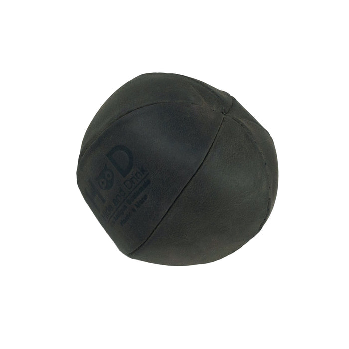 Hide & Drink green Stress Ball showcasing fine stitching, ideal for relieving fidgeting and anxiety while exercising hand muscles. This squishy tension accessory is handcrafted from full grain leather in La Antigua Guatemala.
