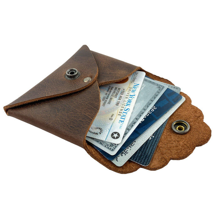 Dimensions of the Stylish Envelope by Heather's, illustrating its compact size and usability. Ideal for organizing debit and credit cards, this classy envelope card holder is constructed from durable full grain leather, showcasing hand cut and hand sewn craftsmanship along with fire branding, handmade in La Antigua Guatemala & Oaxaca Mexico.