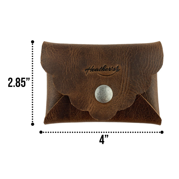 Stylish Envelope by Heather's alongside a beautifully designed greeting card, emphasizing its role as a classy organizer. This compact storage solution for debit and credit cards is crafted from full grain leather with small batch production, hand cut and sewn features, and fire branding, proudly handmade in La Antigua Guatemala & Oaxaca Mexico.