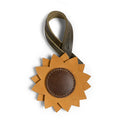 Hide & Drink Bag Charms featuring a sunflower design, ideal charm for handbags and purse charm for tote & backpacks. Crafted from full grain leather, these ornaments for women deliver a unique charm, embodying StockyardX's small batch production, hand cut, and hand sewn techniques. Fire branded craftsmanship highlights its artisan quality, handmade in La Antigua Guatemala & Oaxaca Mexico.