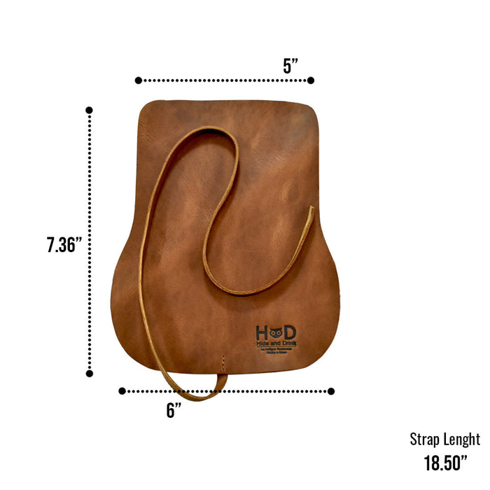 Hide & Drink Sunglass Wrap is crafted from premium full grain leather for durability. This eye glasses storage solution is ideal for travel, showcasing handmade artisan quality. Each piece is hand cut and sewn in La Antigua Guatemala, ensuring rustic elegance.
