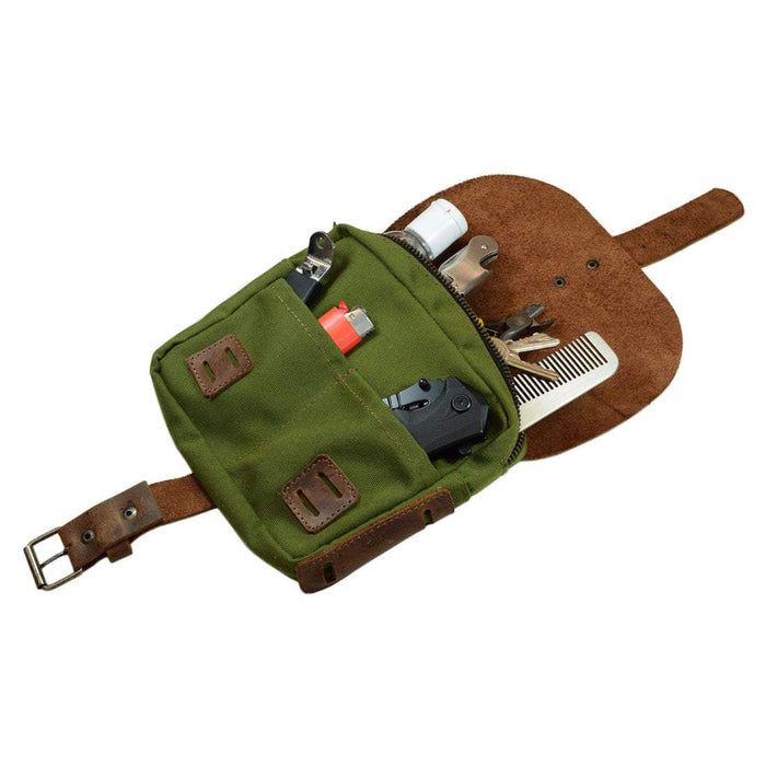 Open view of green Survival Camping Pouch by Hide & Drink, showcasing its utilitarian storage. Crafted from Water Resistant Waxed Canvas & Full Grain Leather, it’s perfect for outdoor essentials.
