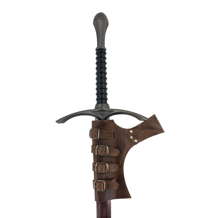 The Sword Frog Leather Holder by Hide & Play shown with a sword, demonstrating its practical design for cosplay and medieval-themed costumes. This full grain leather holder is handcrafted with care, showcasing the artistry of small batch production in La Antigua Guatemala & Oaxaca Mexico.