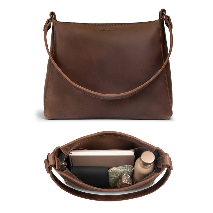 Inside view of The Allandale Tote Bag by Austin Genuine, demonstrating its spacious interior made from full grain leather. This artisan bag is crafted through small batch production, hand cut, hand sewn, and fire branded, reflecting exceptional quality and is handmade in La Antigua Guatemala & Oaxaca Mexico.