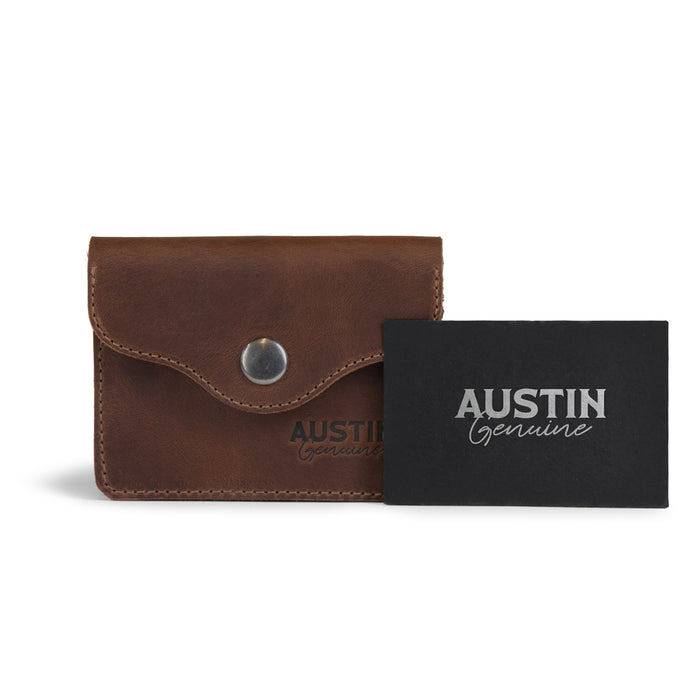 The Hyde Card Wallet by Austin Genuine displayed with its branding card, crafted from premium full grain leather, illustrating the exquisite artisan craftsmanship and fire branded logo associated with small batch production.