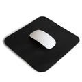 Hide & Drink Mousepad in a minimalist black design, perfect for a modern workspace. This ergonomic mousepad features a non-slip base, crafted from genuine leather by artisans in La Antigua Guatemala & Oaxaca Mexico.
