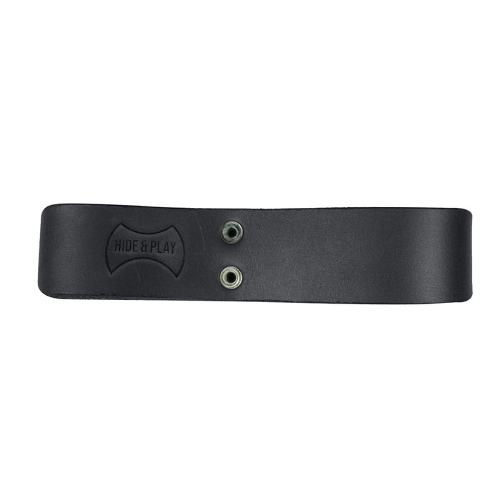 The Thick Whip Holder in black by Hide & Play, featuring notable design elements as a whip holster handcrafted from thick full grain leather. This belt loop bullwhip holder is ideal for pastoral tools, reflecting the quality of small batch production alongside hand cut, hand sewn techniques, fire branded work, and artisan craftsmanship made in La Antigua Guatemala & Oaxaca Mexico.