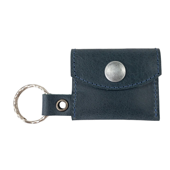 A beautiful arrangement featuring the Tiny Coin Holder Keychain by Hide & Drink. Constructed from premium Full Grain Leather, this Tiny Coin Holder is a mark of small batch artisan craftsmanship.