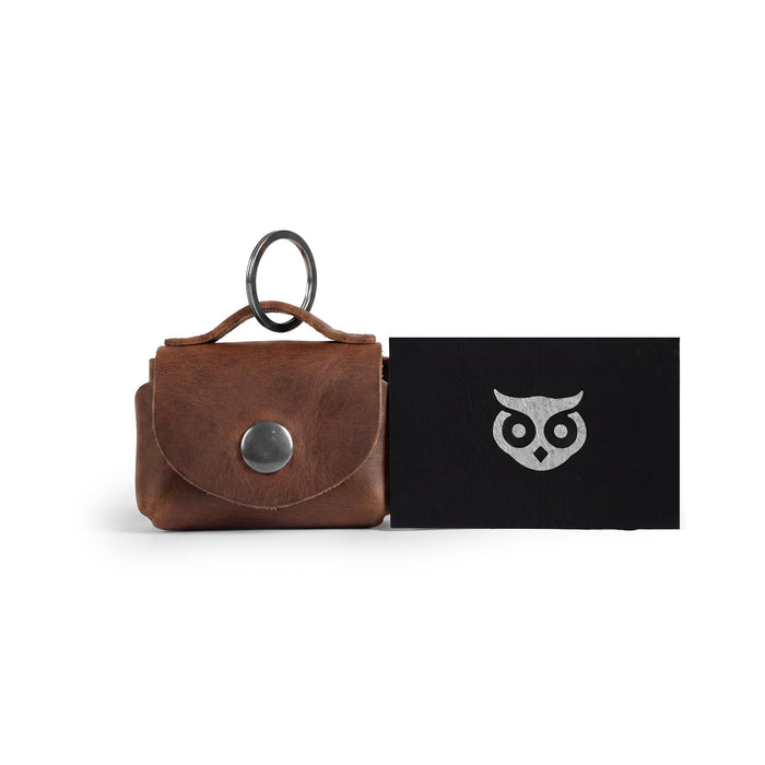 Front view of the Tiny Handbag Keychain, highlighting its rustic charm and key ring holder, made from full grain leather by Hide & Drink. This unique Tiny Handbag with Key Ring Holder combines craftsmanship with small batch production, hand cut, hand sewn, fire branded features, and it’s artisan-made in La Antigua Guatemala & Oaxaca Mexico.