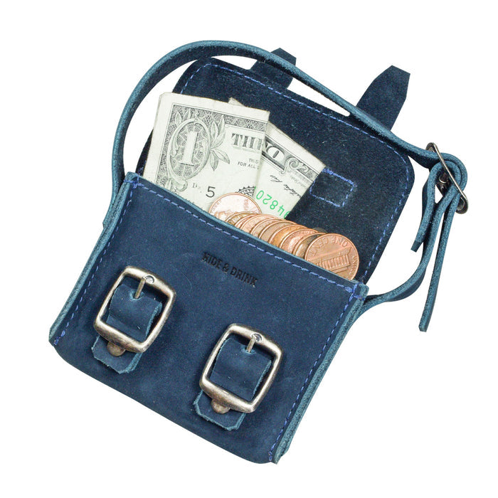 Inside view of the navy Tiny Messenger Bag by Hide & Drink, highlighting space for cash and coins. This Mini Messenger Bag Charm made from premium Full Grain Leather is a versatile keychain or handbag accessory, reflecting artisan quality from La Antigua Guatemala.