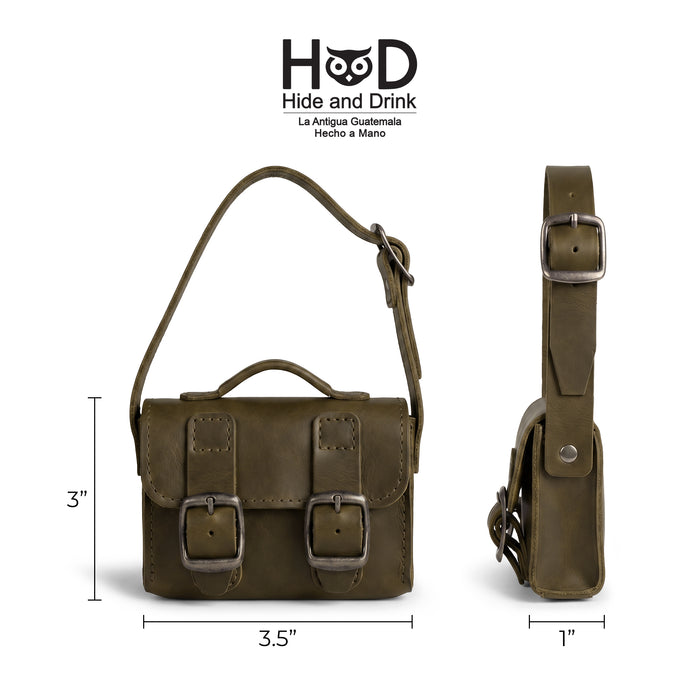 Size dimensions of the green Tiny Messenger Bag by Hide & Drink, measuring 3.5 inches by 3 inches. This practical Mini Messenger Bag Charm in Full Grain Leather is designed for keychain or handbag use, showcasing artisan craft from La Antigua Guatemala.