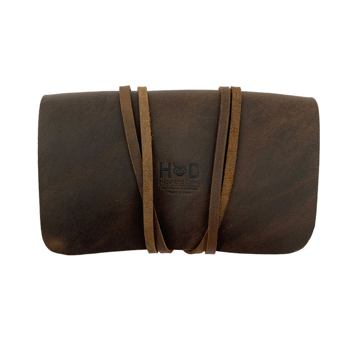 Hide & Drink Tobacco Pouch elegantly closed, a fantastic vintage storage solution for your smoking essentials, made from high-quality leather, hand cut, and sewn.