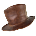 A stylish side view of the Hide & Play Top Hat, emphasizing its classic design and rich leather tones. This Mad Hatter Top Hat is perfect for cosplay, Halloween, performances, films, and shows. With full grain leather construction, it reflects small batch production, hand cut, hand sewn craftsmanship, and fire branding by artisans in La Antigua Guatemala and Oaxaca Mexico.