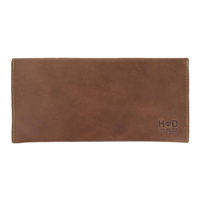The back of Hide & Drink's brown Travel Hand Wallet, showcasing the quality of Full Grain Leather and craftsmanship. This Travel Wallet represents Small Batch Production and is handmade in La Antigua Guatemala & Oaxaca Mexico.