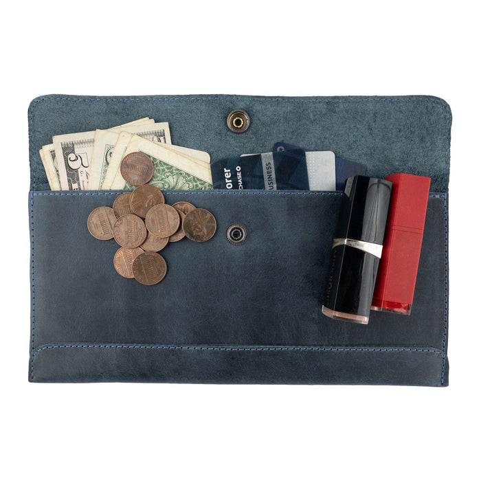 Front view of Hide & Drink's navy blue Travel Hand Wallet, featuring a stylish closure and exquisite Full Grain Leather texture. This Travel Wallet is expertly crafted through Small Batch Production in La Antigua Guatemala & Oaxaca Mexico.