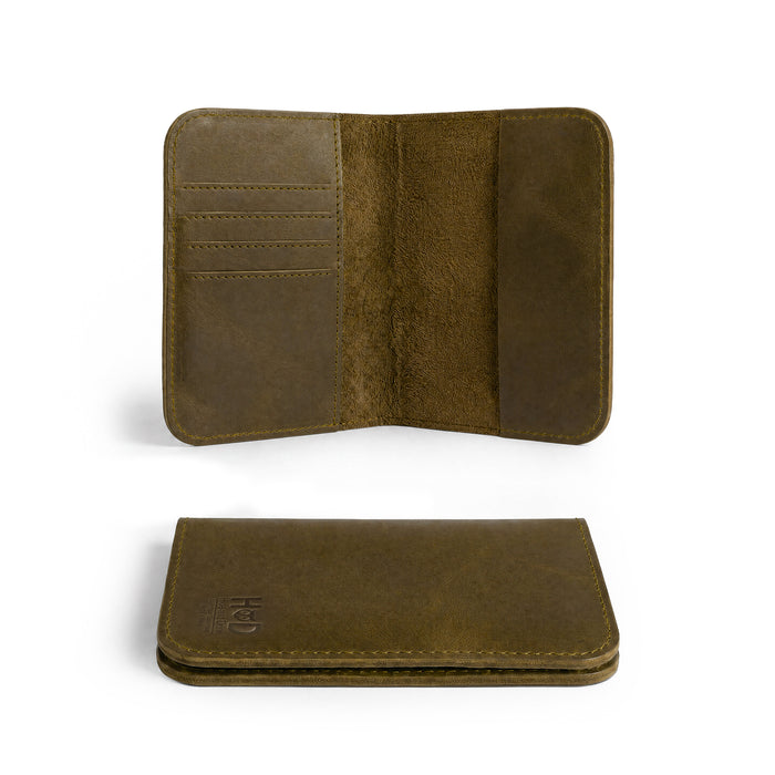 Open interior view of the Hide & Drink Travel Wallet revealing card slots and cash sections. This travel wallet serves as a functional bifold passport case, artisan-crafted in La Antigua Guatemala.