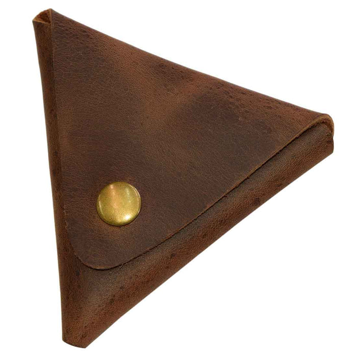Closed view of Triangle Coin Pouch by Hide & Drink, featuring a durable press fit closure. This Triangle Coin Pouch is made from Full Grain Leather, ideal for storing cash, cords, and other small items. Emphasizing artisan quality and small batch production, this item is hand cut, hand sewn, and fire branded, made in La Antigua Guatemala & Oaxaca Mexico.