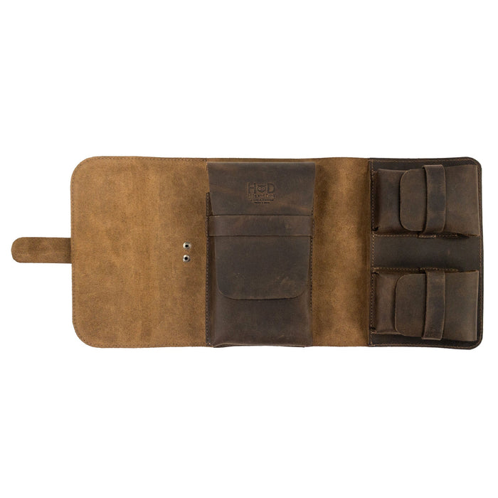 Open interior of the Triple Cigar Case by Hide & Drink, displaying slots for cigars and compartments for accessories. Made from full grain leather, this rustic tobacco pouch is hand cut and hand sewn, emphasizing artisan craftsmanship.