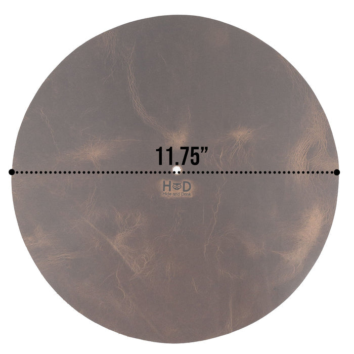 Hide & Drink Turntable Slipmat with product details card, emphasizing its full grain leather construction and unique artisan finish. This classy slipmat is designed to reduce static and enhance sound quality, showcasing the small batch production craftsmanship from La Antigua Guatemala.