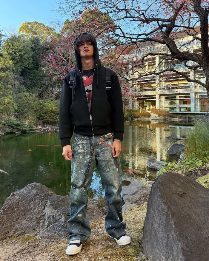 Relaxed fit denim pants made from heavyweight fabric with all-over graphic print and sandwash treatment