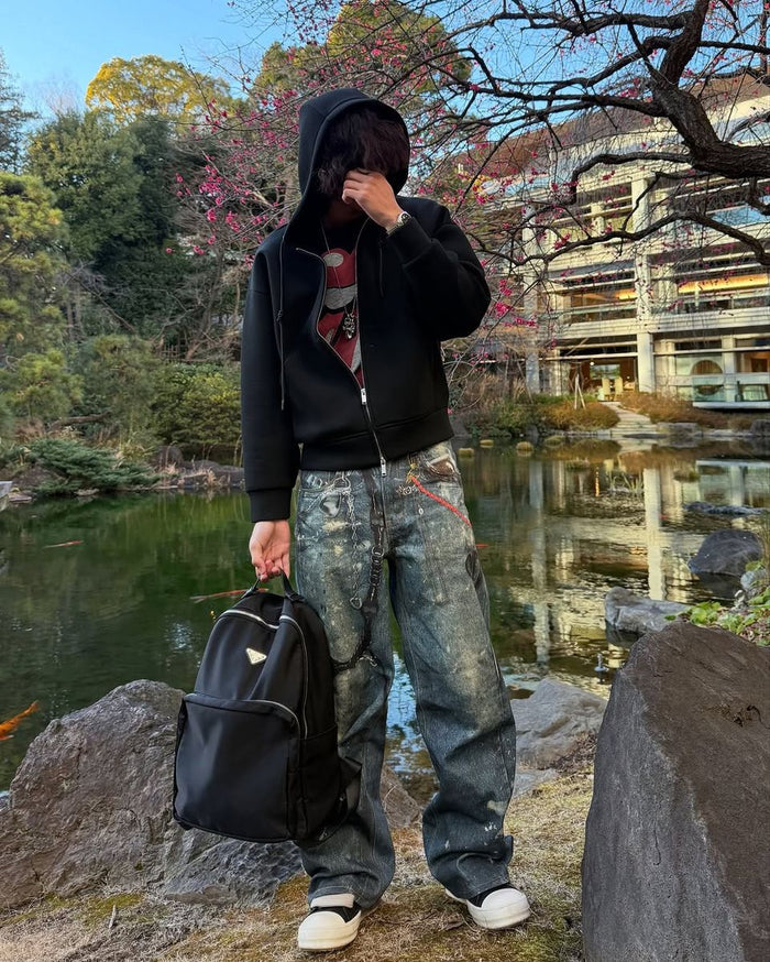 Wideboy Hardware Denim jeans in blue with relaxed fit, graphic print, and sandblast wash finish