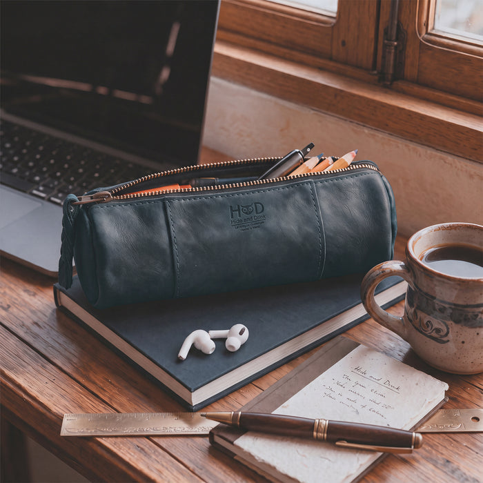 Utility Cylinder Case by Hide & Drink loaded with colorful pens, showcasing its practicality for daily use. This artisan-crafted bag is made from Full Grain Leather, ideal for personal items. Cylinder Case, Classic Bag, Handmade.