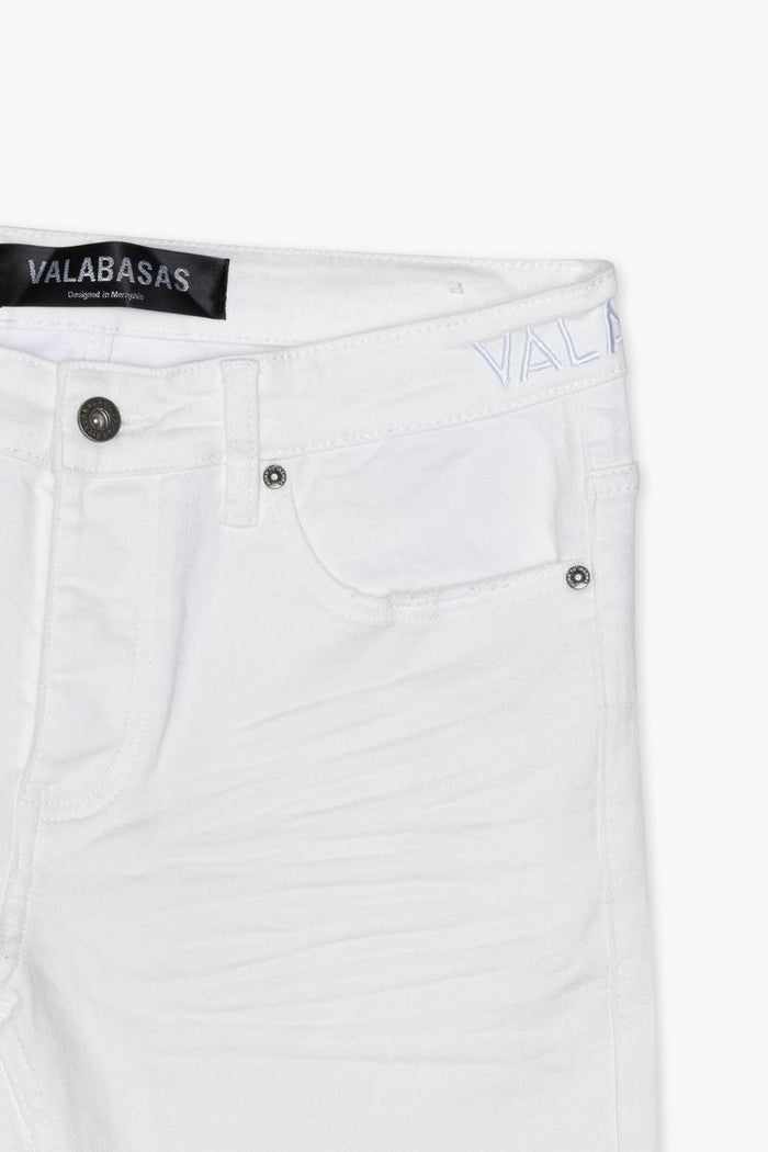 Full-length shot of Valabasas Mr Stacked white denim jeans highlighting the fitted silhouette and clean finish
