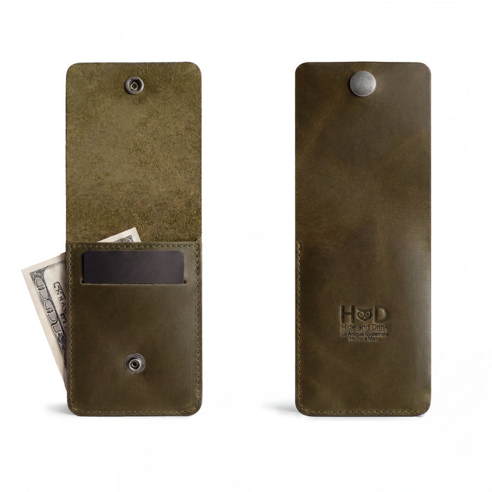 Front view of a green variant of the Vertical Wallet by Hide & Drink, featuring a press stud closure. This Vertical Front Pocket Wallet with Card Slot delivers compact storage for bills and card holding, constructed from durable full grain leather showcasing small batch craftsmanship, hand cut, hand sewn, and fire branded. Handmade in La Antigua Guatemala & Oaxaca Mexico.