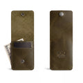 Front view of a green variant of the Vertical Wallet by Hide & Drink, featuring a press stud closure. This Vertical Front Pocket Wallet with Card Slot delivers compact storage for bills and card holding, constructed from durable full grain leather showcasing small batch craftsmanship, hand cut, hand sewn, and fire branded. Handmade in La Antigua Guatemala & Oaxaca Mexico.
