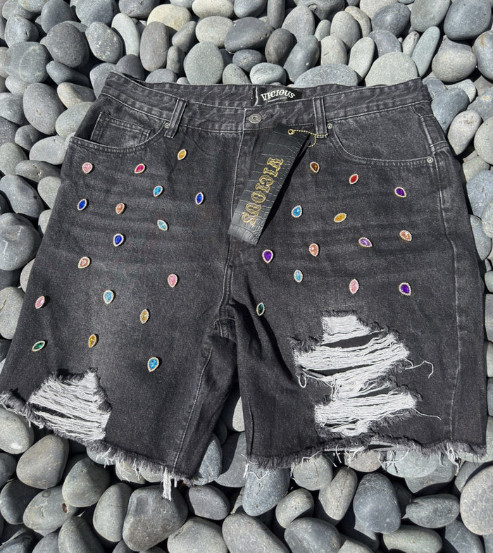 Stylish black denim shorts decorated with sparkling gem stones and a trendy design