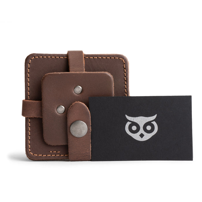 Vintage Squared Coaster (8 pack) by Hide & Drink featuring a stylish presentation of coasters paired with a business card. This coasters set of 8 not only provides table protection for drinks, but serves as a modern elegant accessory. Made from durable full grain leather, this artisan product is hand cut and sewn, boasting fire branding, and represents the craftsmanship that comes from La Antigua Guatemala & Oaxaca Mexico.