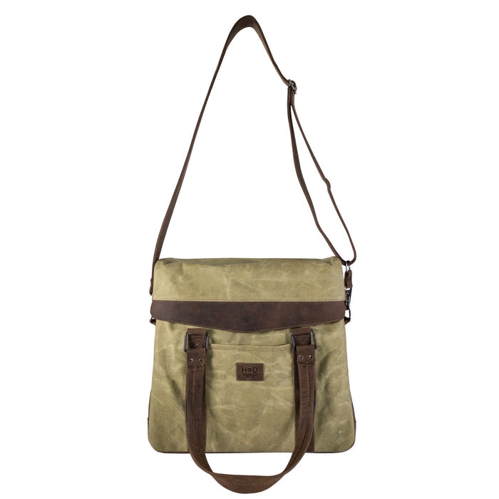 Front view of Hide & Drink's Vinyl Records Messenger Bag, illustrating its stylish and functional design. This handcrafted bag, made from waxed canvas and full grain leather, is perfect for artists on the go, embodying artisan craftsmanship from La Antigua Guatemala & Oaxaca Mexico.