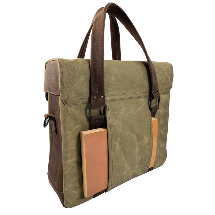 Back view of the Vinyl Records Messenger Bag by Hide & Drink, highlighting the sturdy construction with a sleek design. This bag is a great choice for musicians and vinyl lovers, representing handmade quality from La Antigua Guatemala & Oaxaca Mexico, made from waxed canvas and full grain leather.