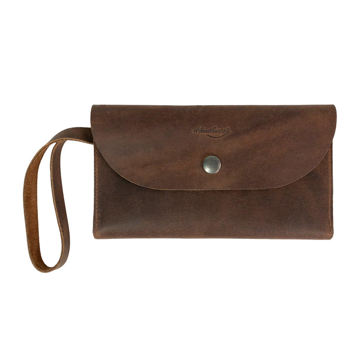 Heather's Wallet with Wristlet featuring a sleek rectangular design, perfectly suited for women. This purse includes multiple card slots and is crafted from Full Grain Leather, making it an ideal travel accessory and money organizer. StockyardX, Small Batch Production, Hand Cut, Hand Sewn, Fire Branded, Artisan, Handmade in La Antigua Guatemala & Oaxaca Mexico.