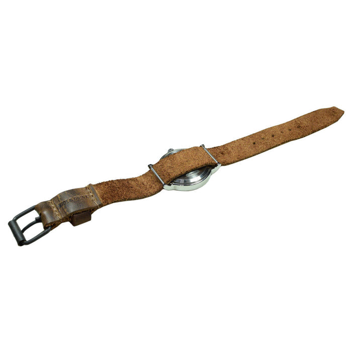 An elegantly styled Watch Strap (20mm) by Hide & Drink, perfectly fitted to a wristwatch. This leather rustic wristwatch strap replacement (20mm buckle, 18mm strap) exemplifies the beauty of full grain leather. It's not just an accessory; it's an artisan’s work, made with attention to detail through small batch production, hand cut, hand sewn, and fire branded finishing. Handmade in La Antigua Guatemala & Oaxaca Mexico.