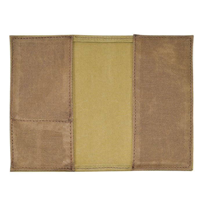 Back view of the Hide & Drink Waxed Canvas Field Notes Cover, showcasing its simple yet functional design. This durable journal cover, made from Full Grain Leather, includes compartments for cards and writing tools, emphasizing the handmade craftsmanship from La Antigua Guatemala & Oaxaca Mexico.